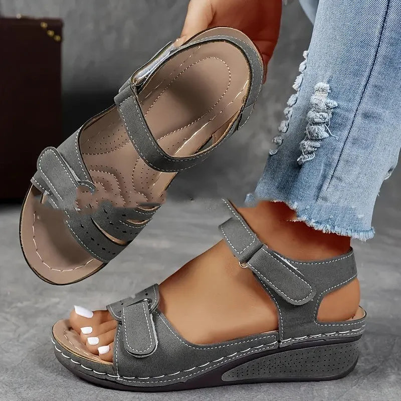 Beige plus size strap sandals with a thick composite sole and Velcro closure on a white background.