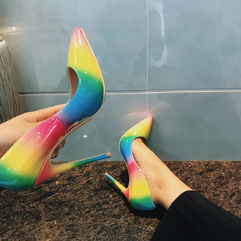 Rainbow patent leather women's high heel shoes with pointed toe and thin heel.