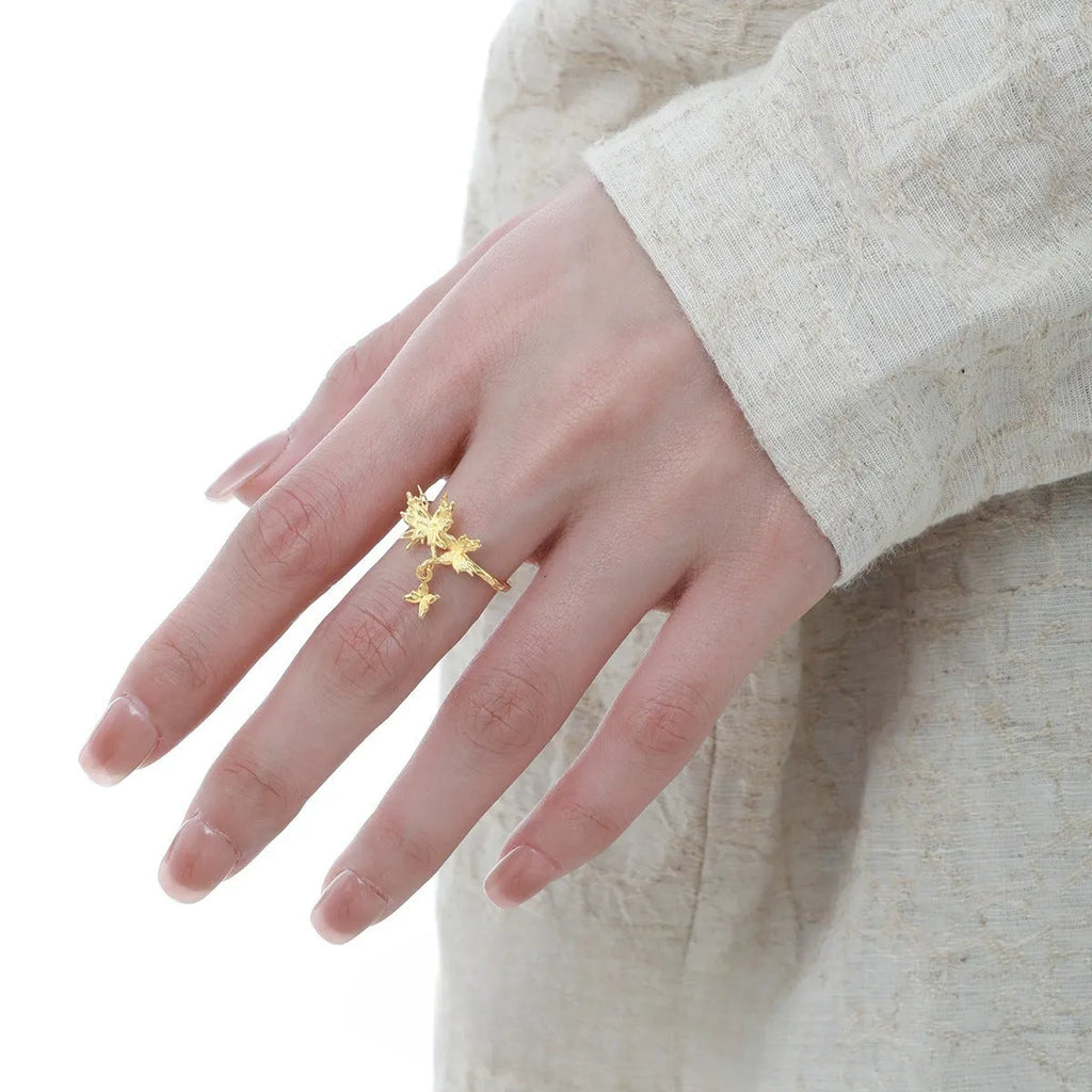Women's silver butterfly ring with adjustable opening in gold-toned finish