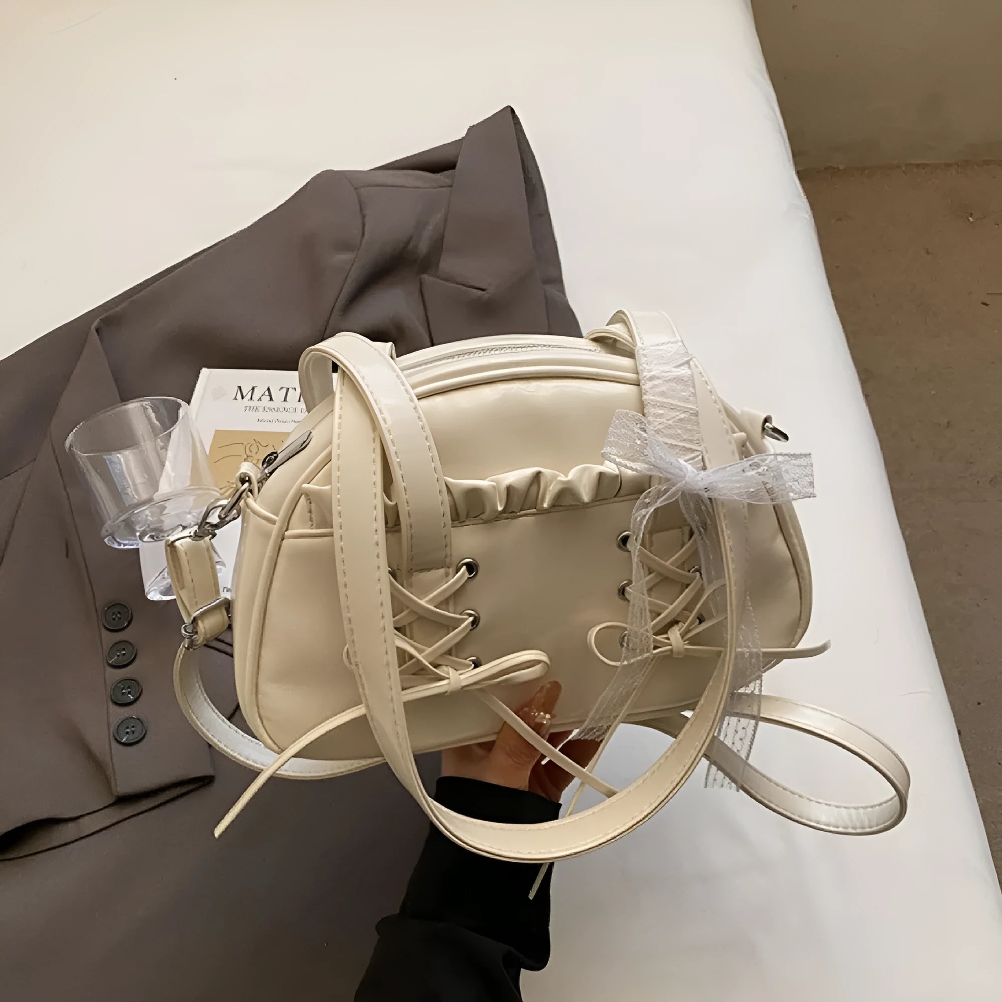 Women's PU leather shoulder handbag with removable bandage bow and phone compartment in milky white