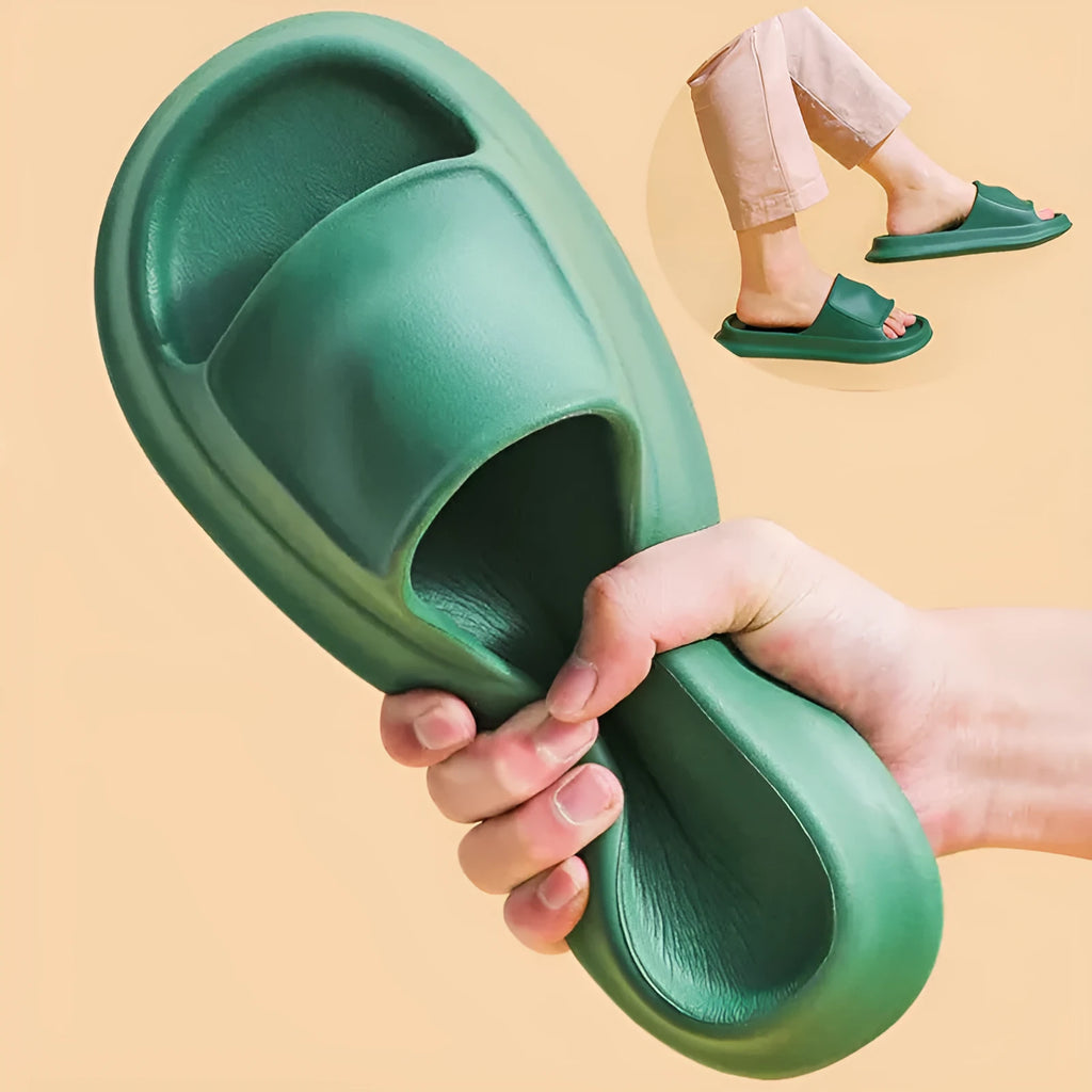Soft EVA slippers with thick non-slip sole in various colours on a bathroom floor.