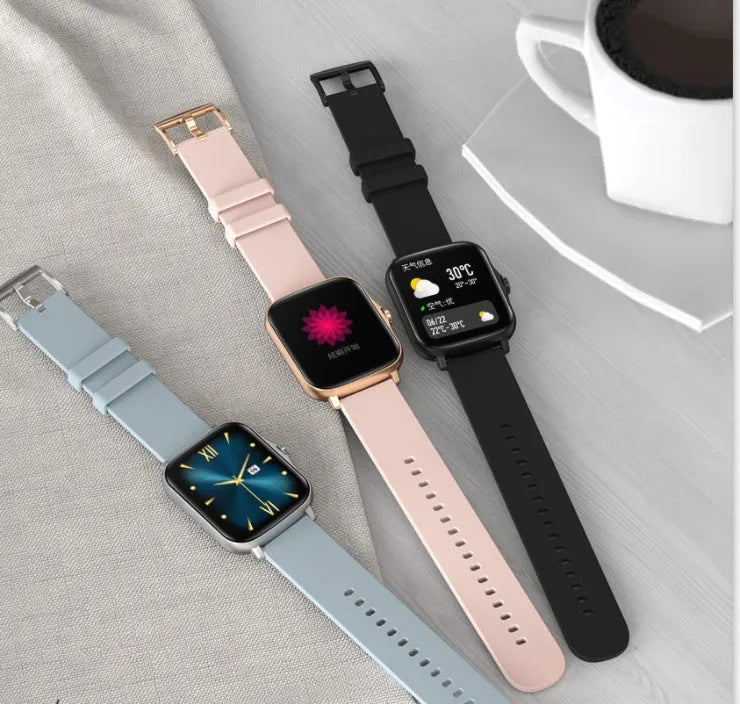Black smart sports watch with a 1.7-inch colour touch screen on a adjustable strap, showing the home screen interface.