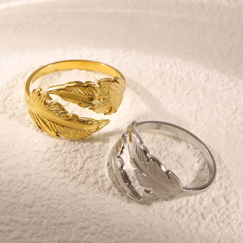 Adjustable stainless steel feather ring with electroplated silver or gold finish