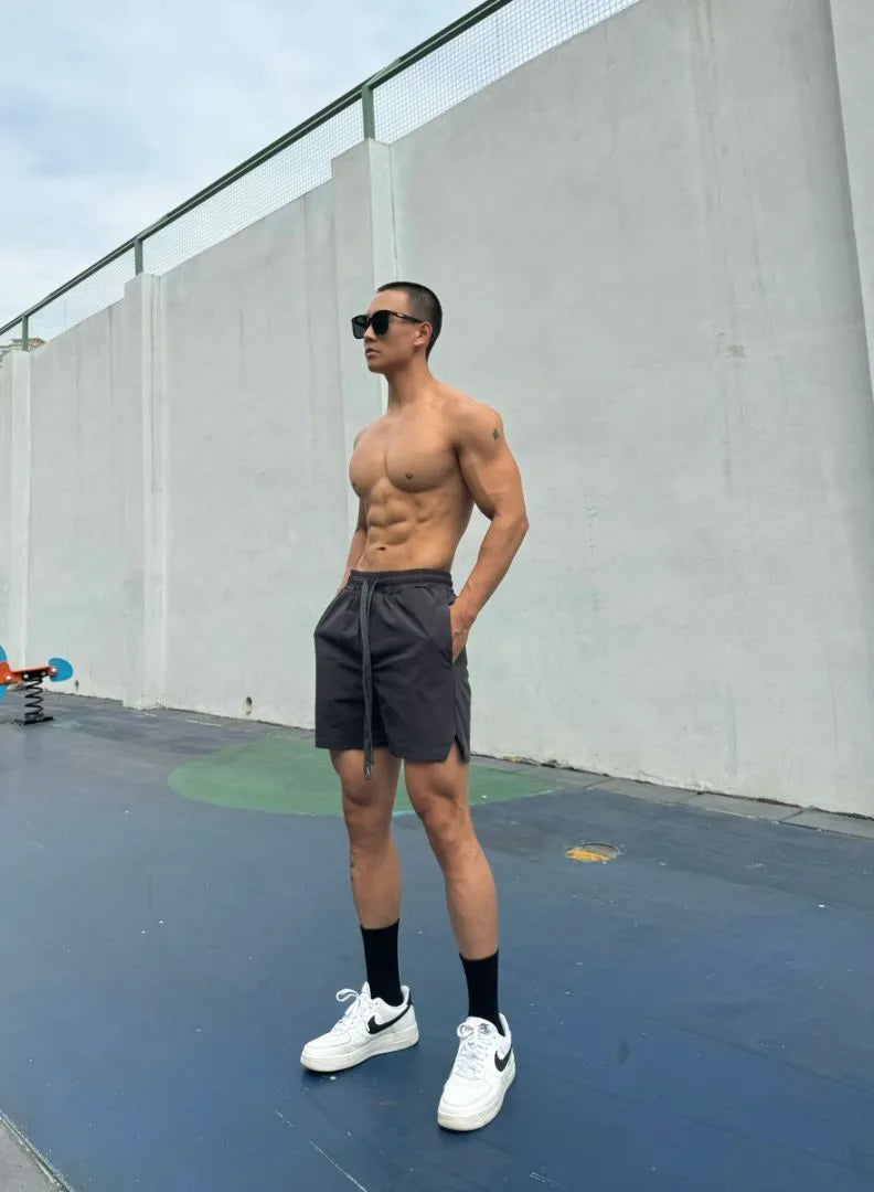 Man wearing grey ice silk quick-dry double-layer quarter-length casual shorts