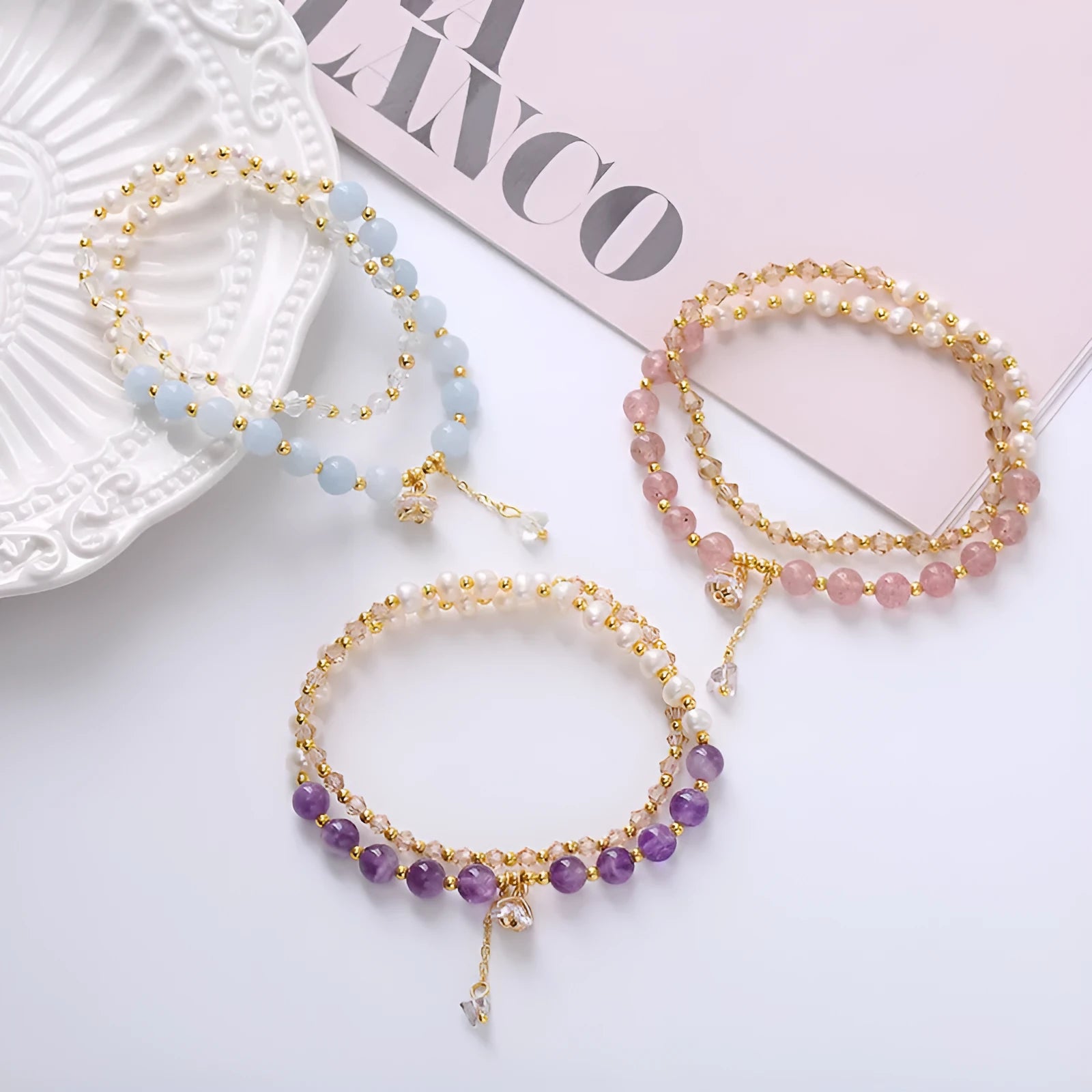 Natural freshwater pearl and crystal double ring bracelet in strawberry quartz, amethyst, or aquamarine.