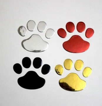 PVC car sticker shaped like a hand holding a brush, decorated with dog footprints pattern.