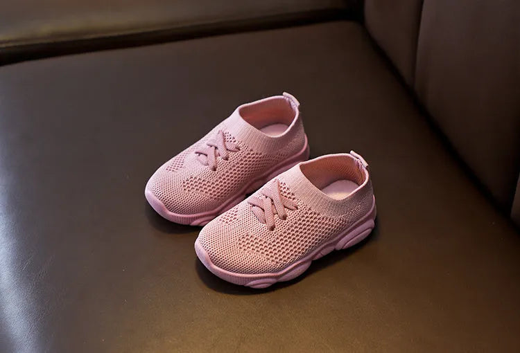 Children's lazy slip-on shoes in fabric with non-slip rubber sole, shown in available colours.