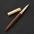 Brass and sandalwood signature pen showing wood grain and metal details at 14cm length