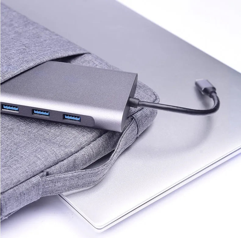 10-in-1 USB C docking hub and portable PD power bank compatible with Apple MacBook and iPhone.