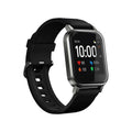Black waterproof smart bracelet with 1.4-inch screen and silicone strap on a wrist.