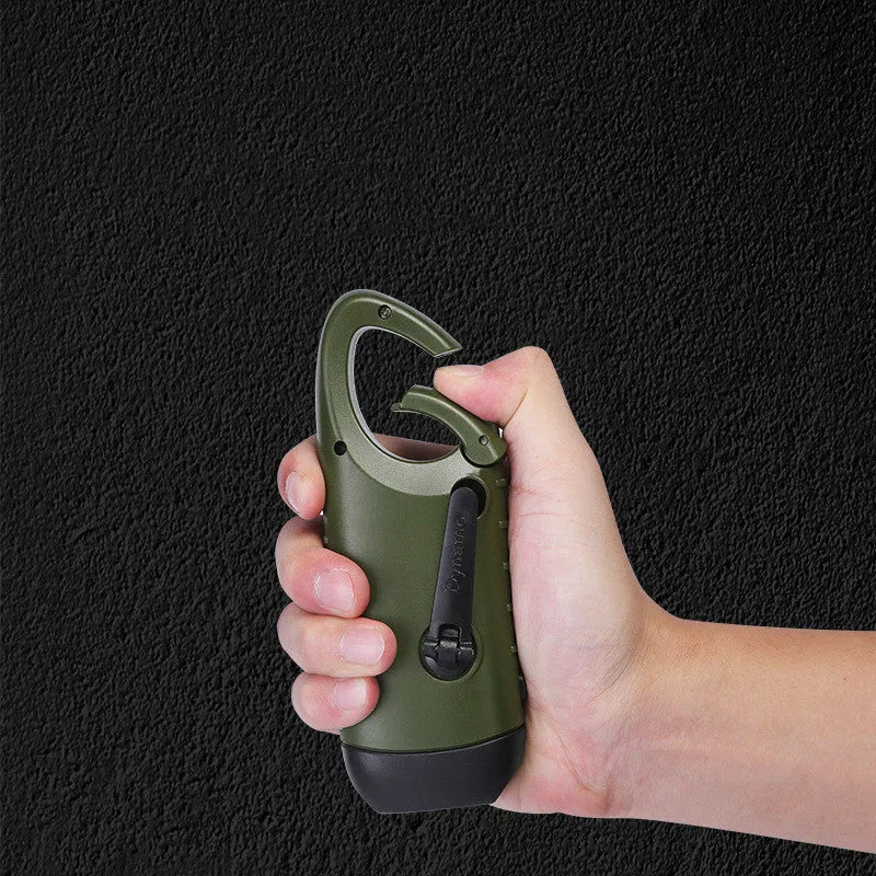 Hand-crank and solar powered olive green LED flashlight with USB charging port.
