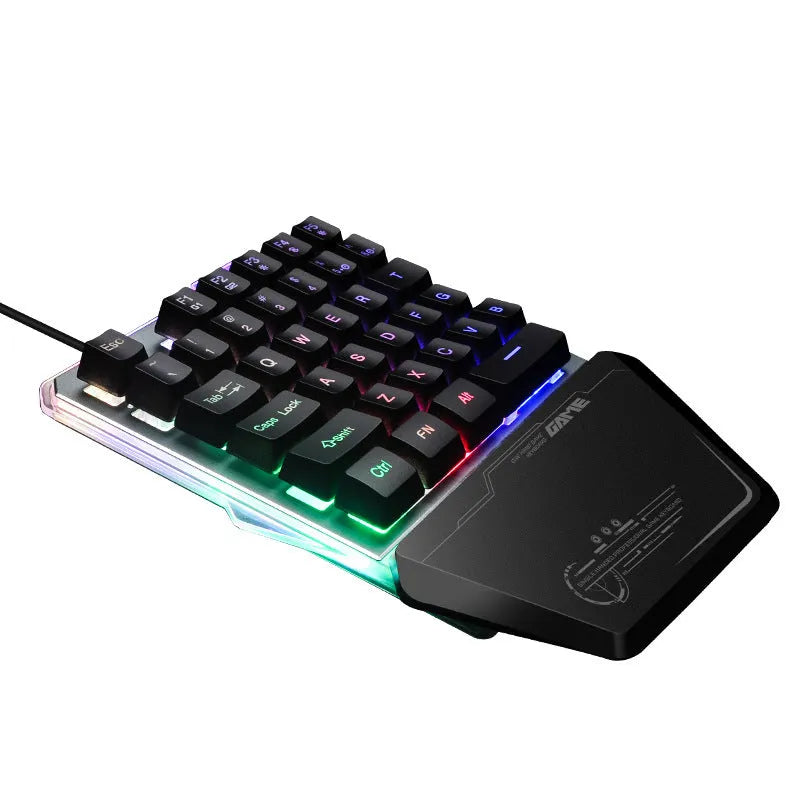 G40 Flow black one-handed mechanical keyboard with RGB backlit keys on a desk