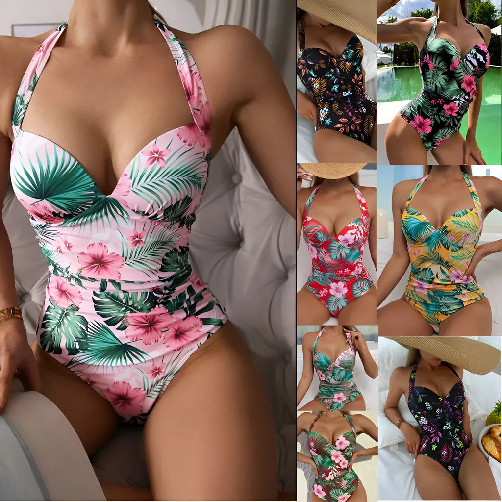 Women's printed halter neck one-piece swimsuit on a hanger, showing backless design.
