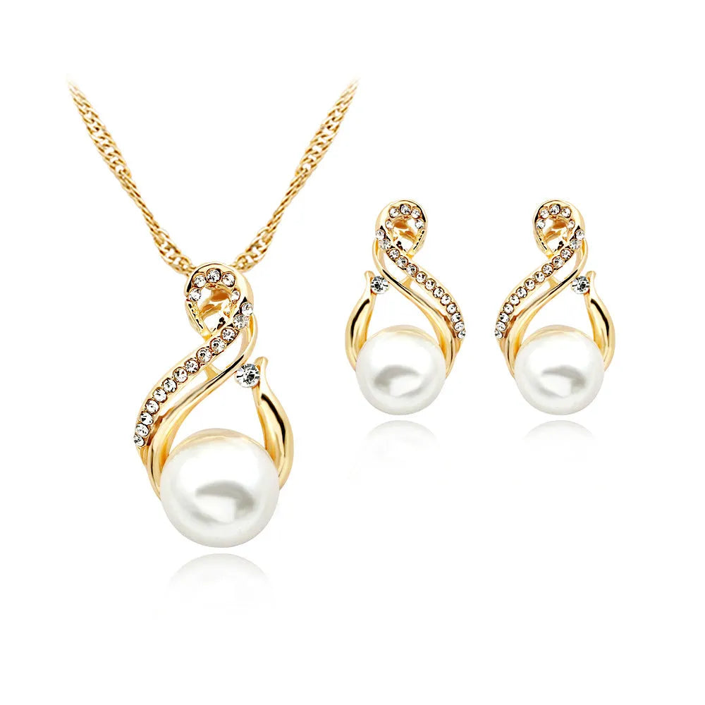Gold tone pearl necklace and earrings set on display showing CA410-A colour with diamond-cut alloy finish