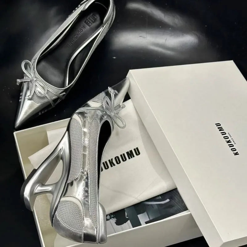 Black women's pointed toe Mary Jane shoes with a unique floating shaped heel and slip-on design.