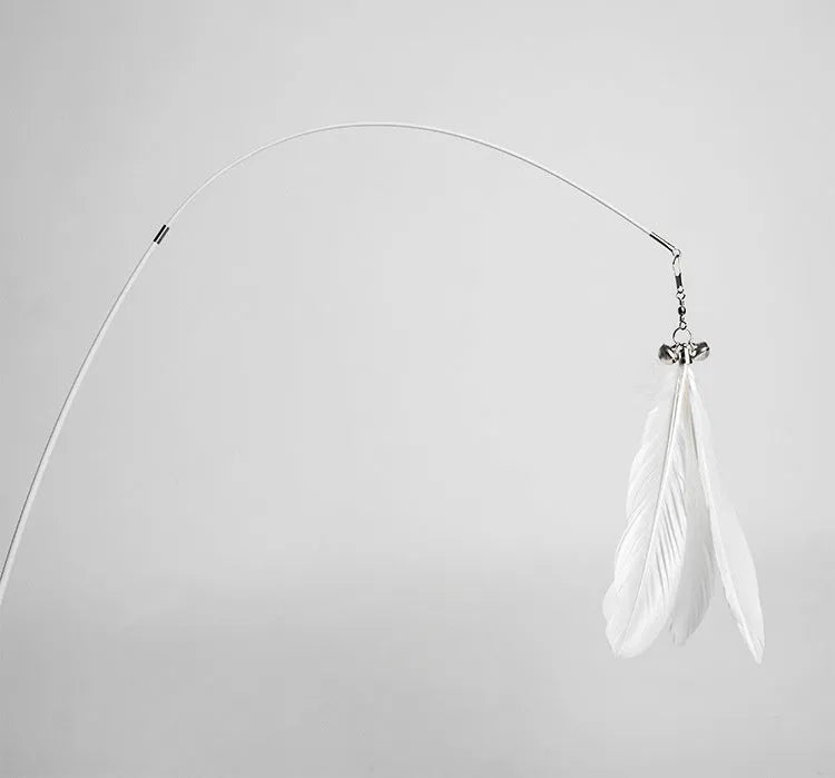 White telescopic fishing rod cat toy extended, with goose feather attachments and a small bell, on a neutral background.