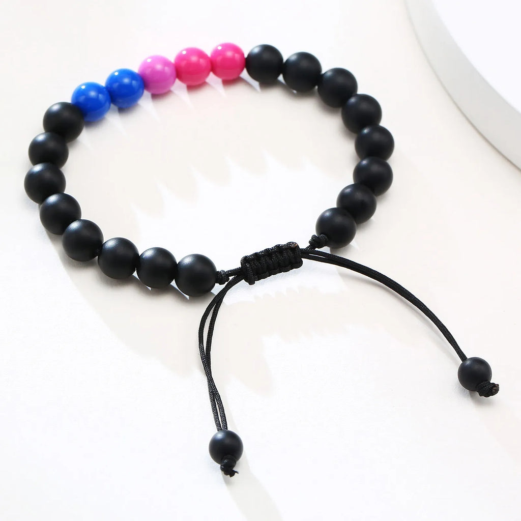 Polished black agate beaded bracelet with 8mm beads, unisex style, on a neutral background.