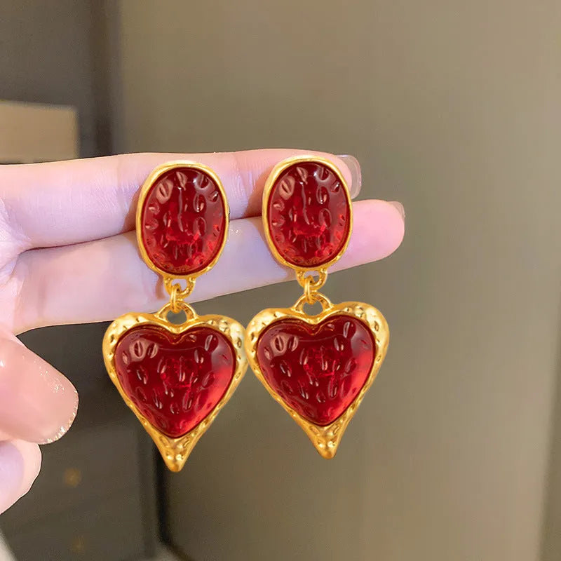 Oval love heart stud earrings with pleated texture in purple, red, green, and yellow-white colour options