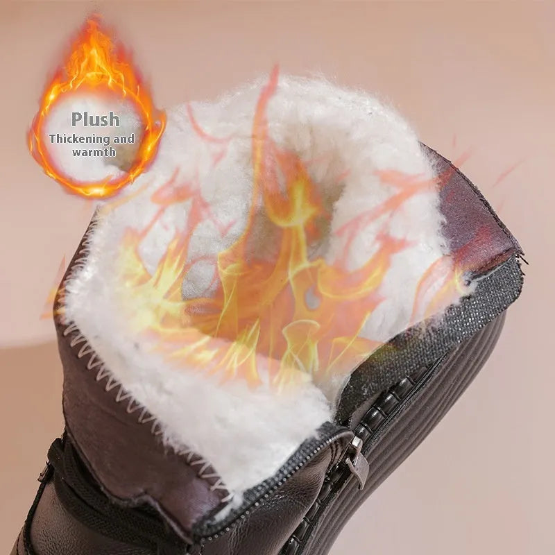 Pair of black cowhide ankle boots with side zipper, platform mid heel, and wool fleece lining visible at the top.
