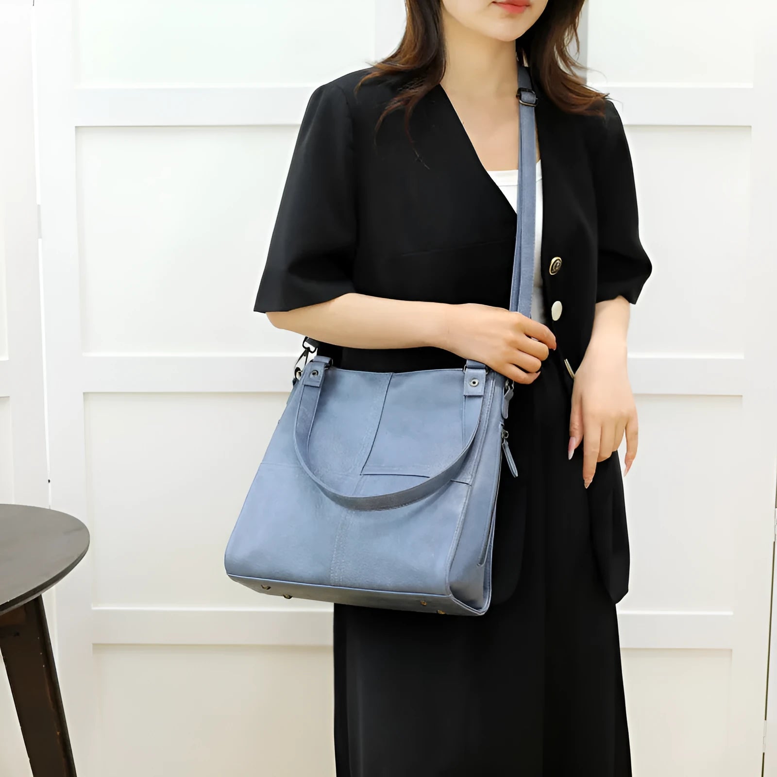 Soft PU leather crossbody handbag with barrel shape and vintage styling in light khaki colour