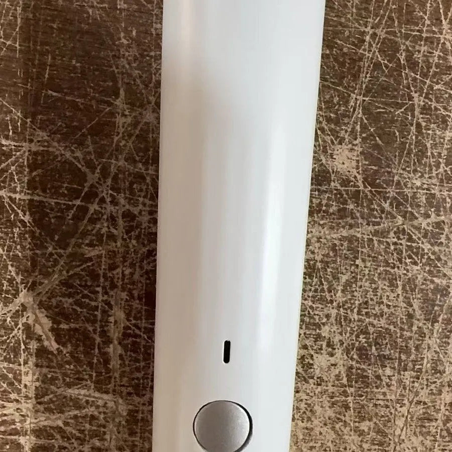 USB electric vacuum sealer pump with reusable food storage envelope bags on a kitchen counter