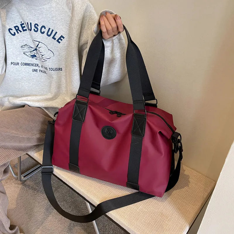 Large waterproof Oxford cloth travel bag with 36-55L capacity in solid colour options