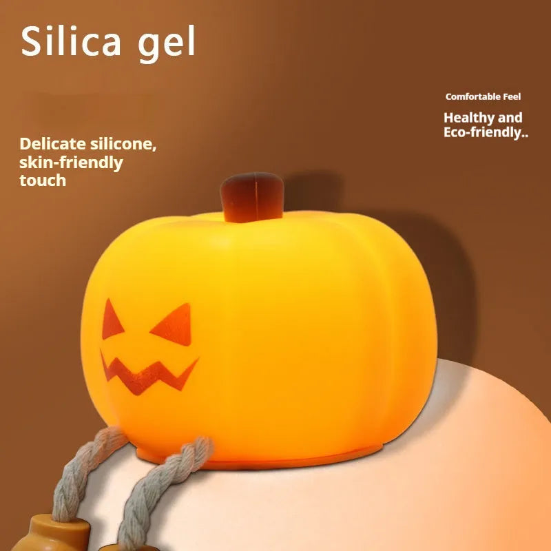 Soft orange silicone pumpkin-shaped night light with a warm glowing light.