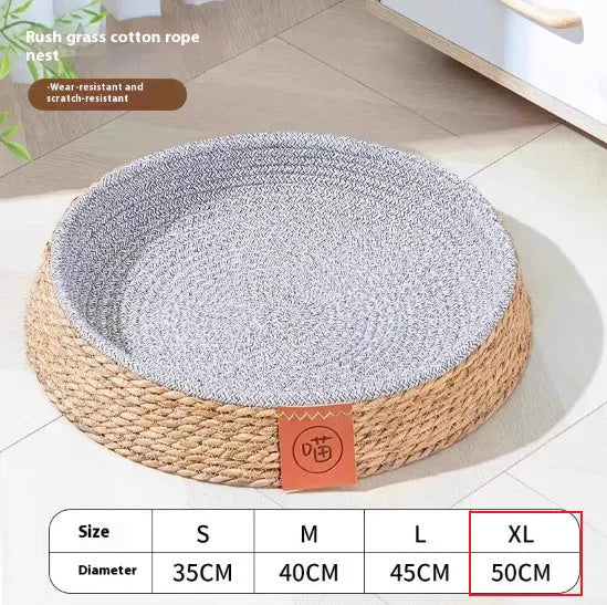 Woven rattan cat nest pet bed in a natural colour, shown in a size suitable for a medium cat.