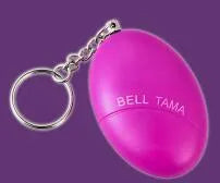 Small black personal safety alarm on a keyring showing pull tab, dimensions 6cm by 4.5cm.