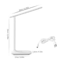 White USB rechargeable bedside lamp with touch dimming controls on a table.