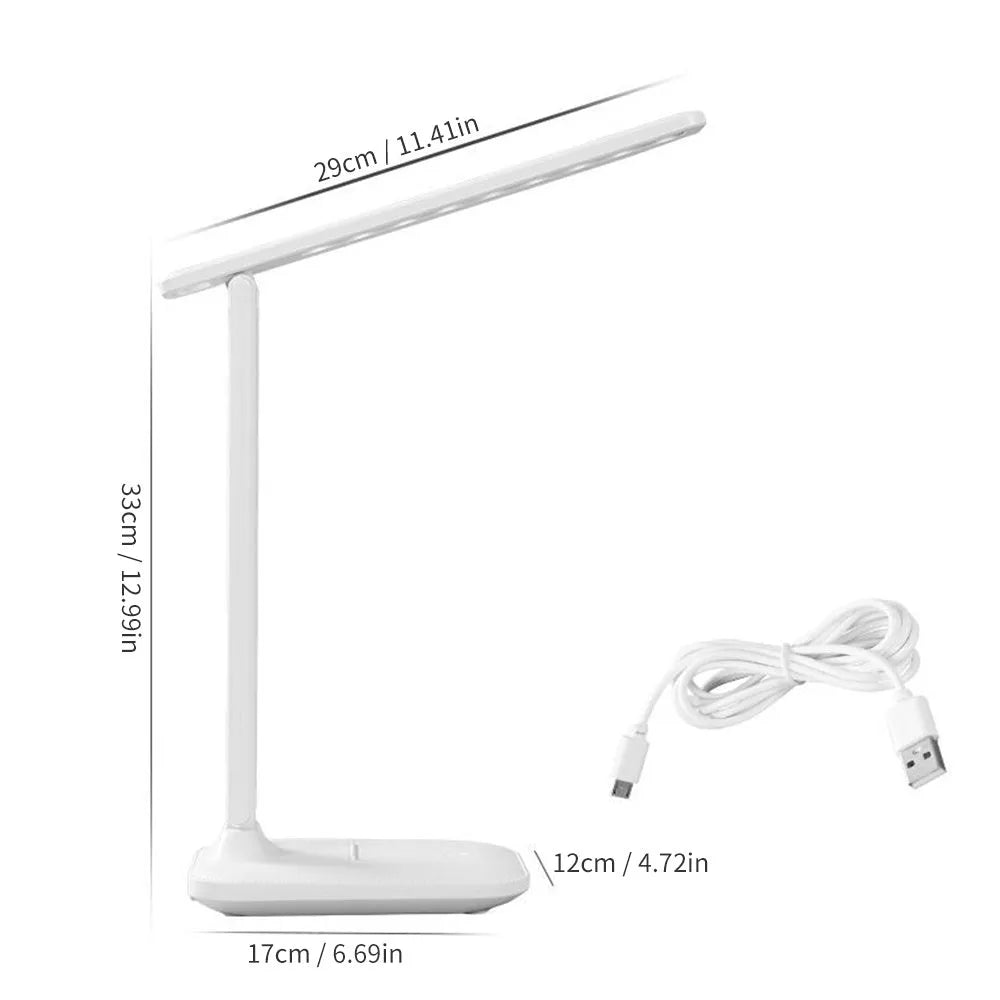 White USB rechargeable bedside lamp with touch dimming controls on a table.