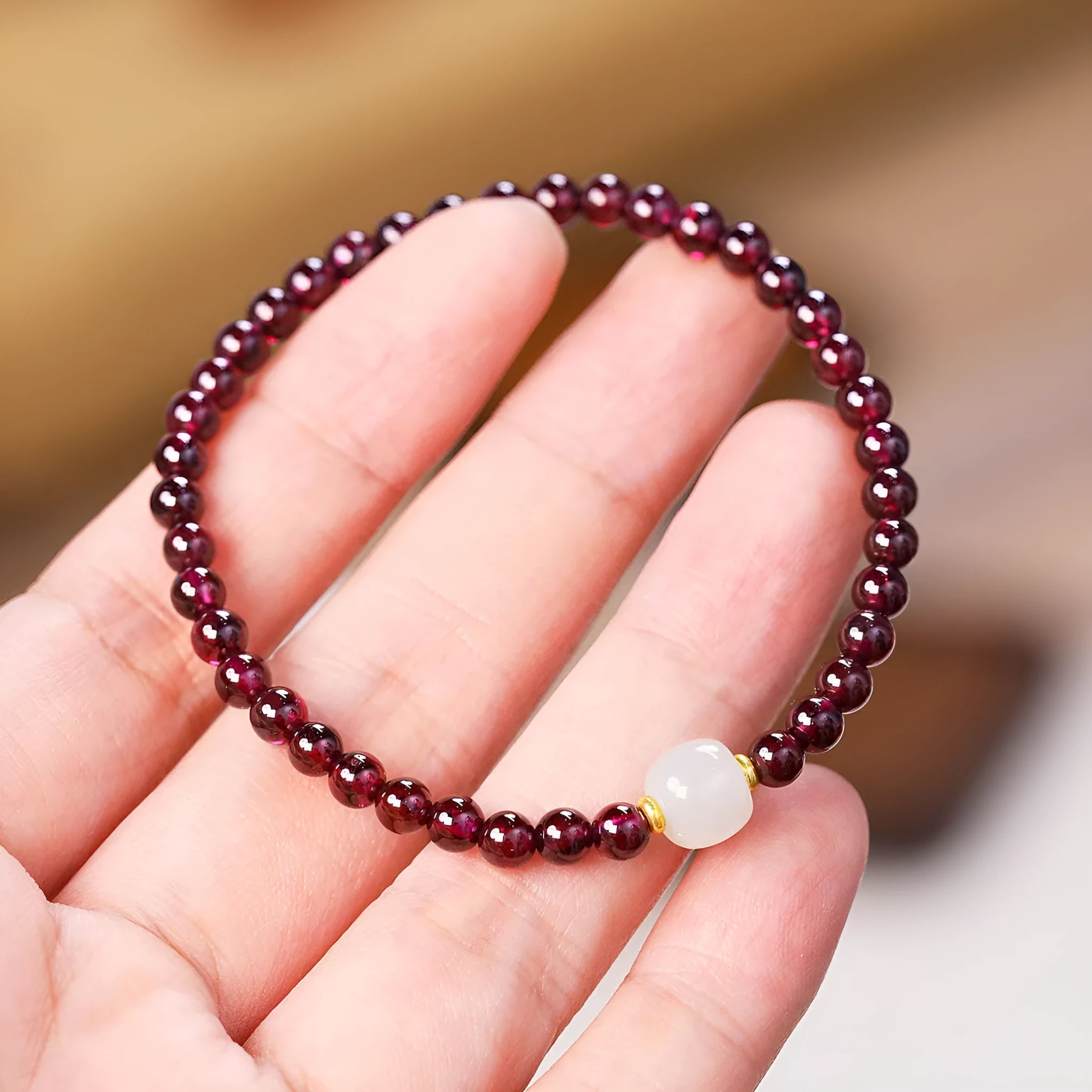 Natural garnet bracelet with U-shaped design, available in 4mm or 6mm stone sizes and two colour variations