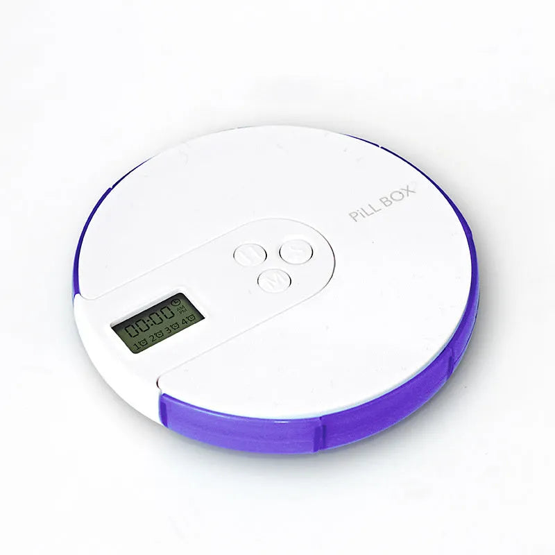 Blue weekly pill organiser with seven compartments, a digital clock display, and clear lids on a wooden table.