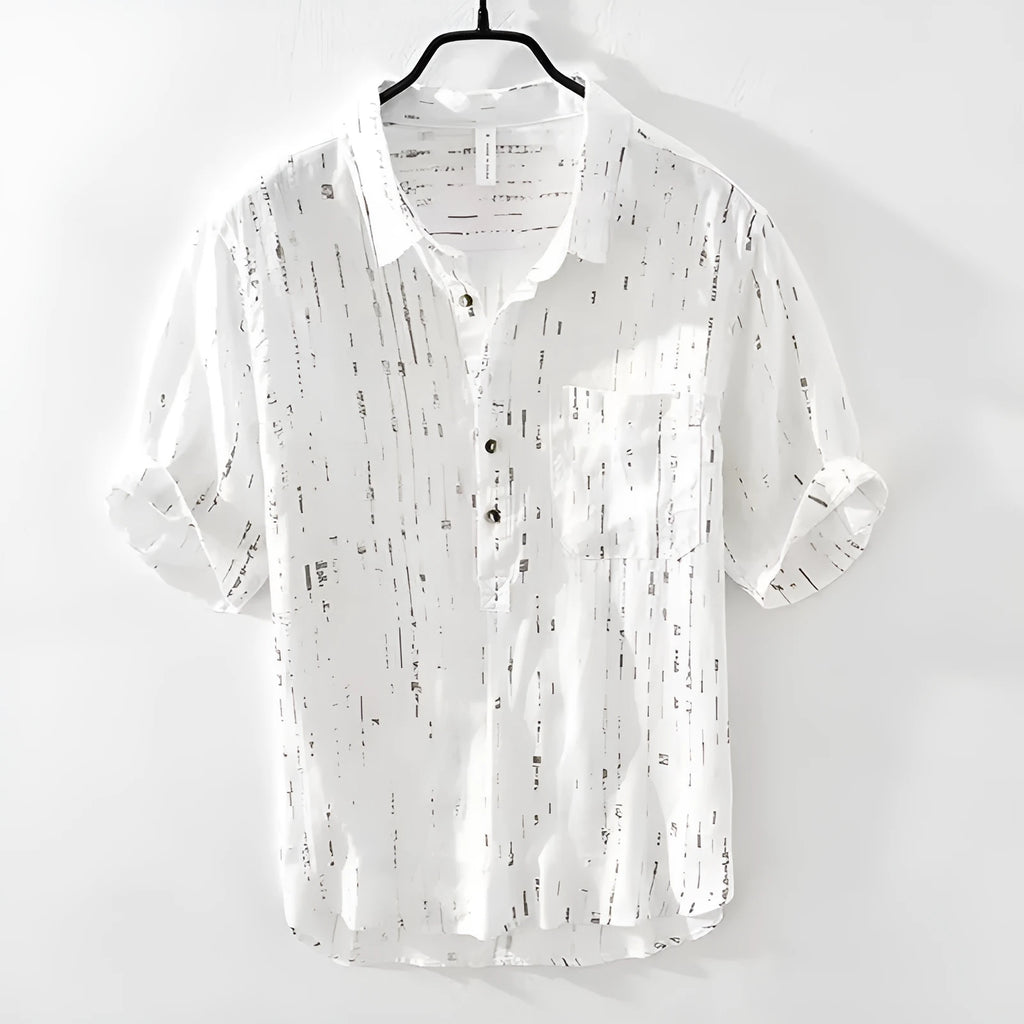 Mens loose-fit black polo shirt with a short sleeve and a V-neck lapel collar on a hanger.