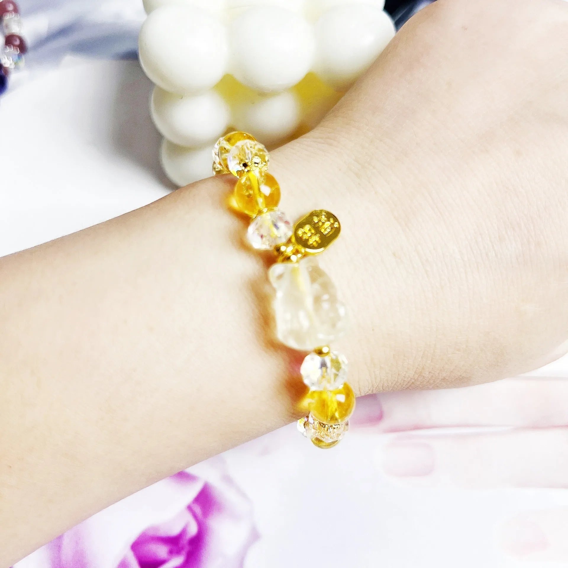 Handmade women's bracelet featuring a nine-tail fox design made from natural citrine crystals.