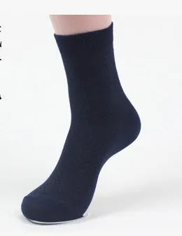 Pack of five men's bamboo fibre ankle socks in different colours, showing small square pattern.