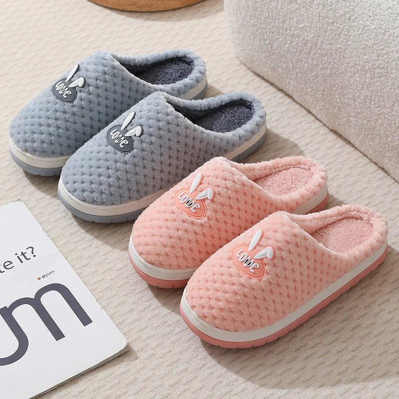 Women's rabbit plaid patterned artificial fur slippers with a thick sole and non-slip rubber base.