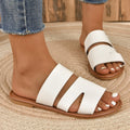 Women's white casual flat slippers with one-line design and rubber sole.