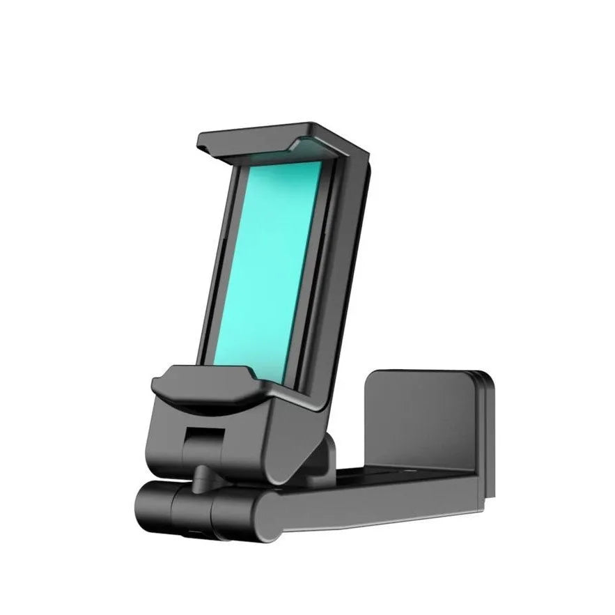 Foldable rotating universal phone holder in black on a desk next to a mobile phone.