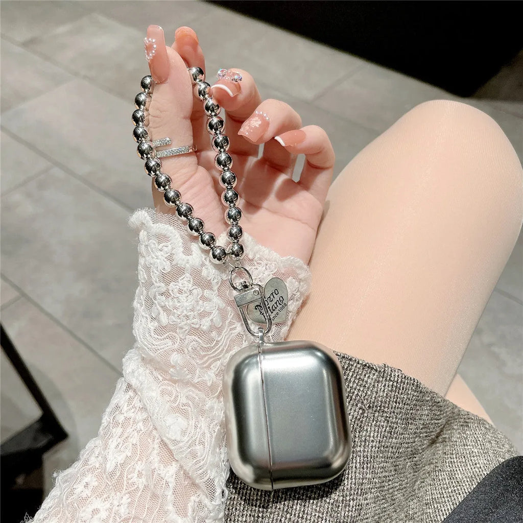 Matte plating TPU protective case for AirPods with an attached bracelet strap.