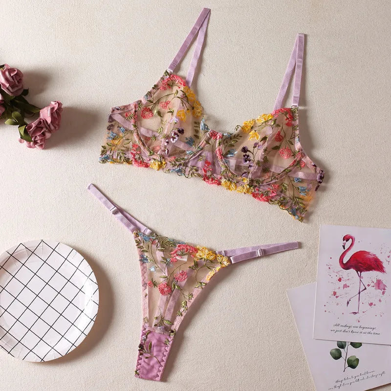Floral patterned mesh bra with steel ring on T-back strap, shown in skin colour.