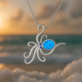 Silver stainless steel necklace with geometric opal octopus pendant on a box chain.