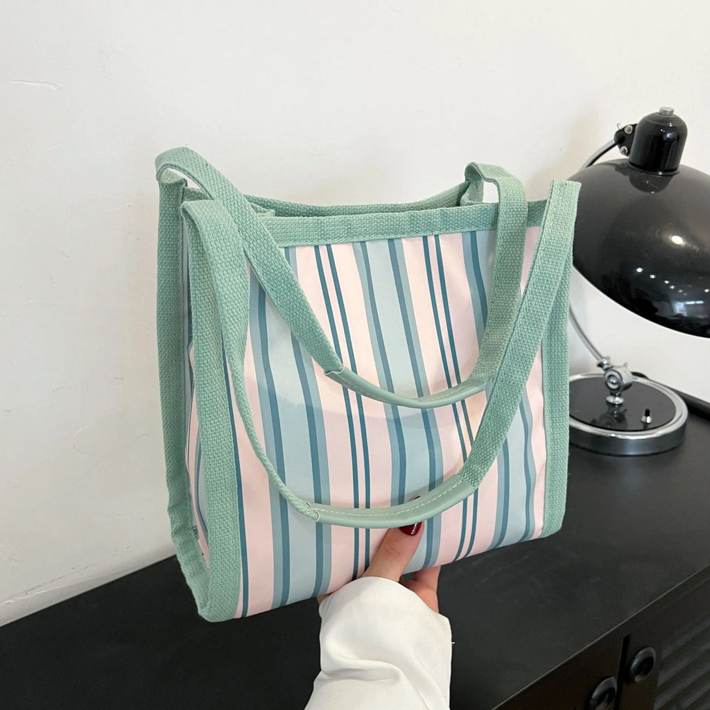 Women's large-capacity urban simplicity tote bag in blue, green, khaki, and pink with internal phone pocket and double shoulder straps