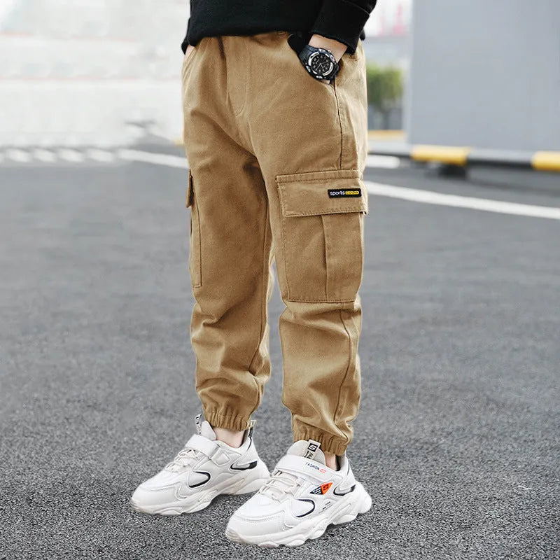 Boys' army green cotton casual trousers with long length, shown on a size chart