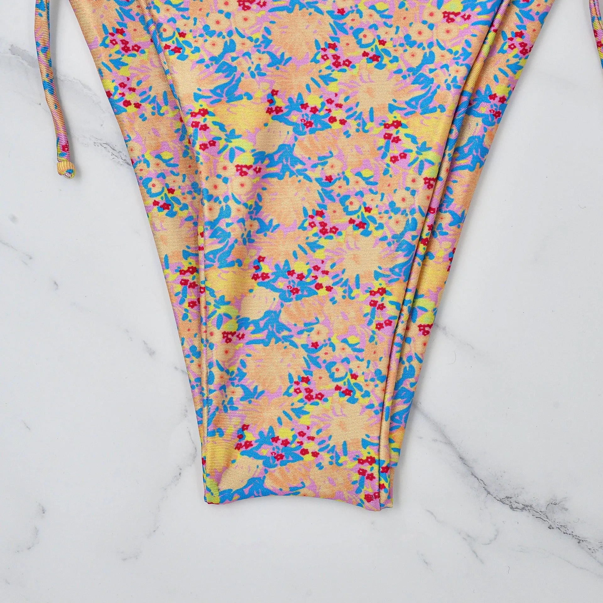 Women's lace-up bikini set in polyester for swimming, showing backless design.