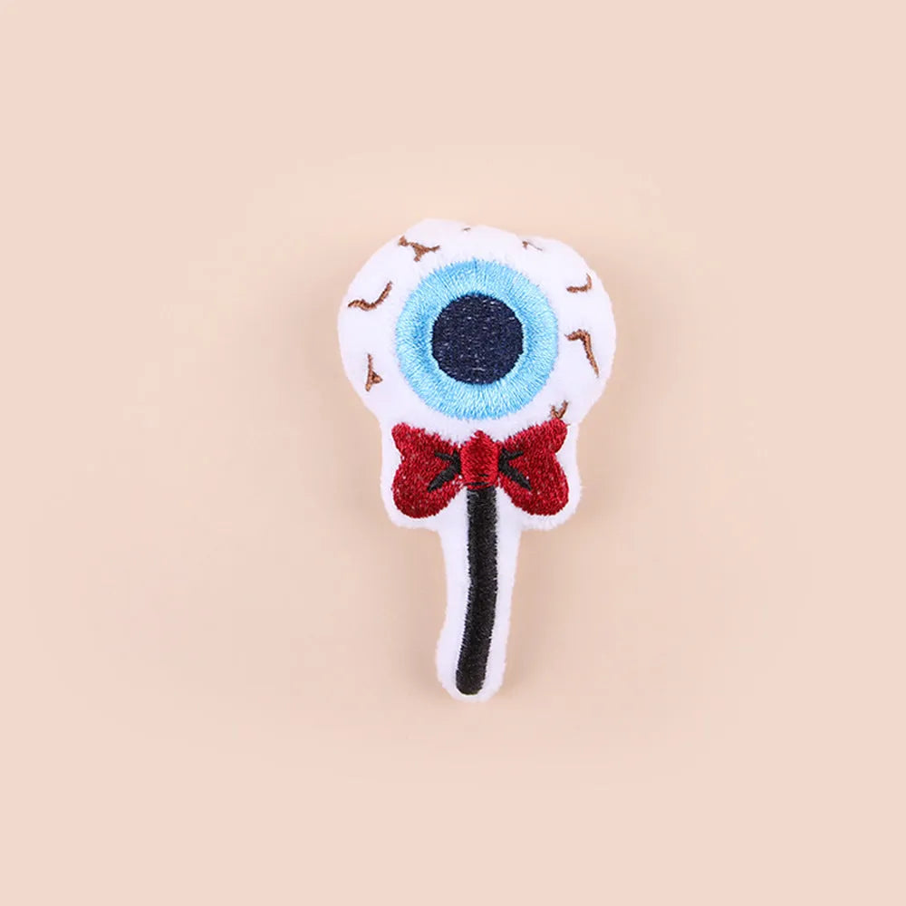 Small plush cat teaser wand with colourful candy design dangling attachment