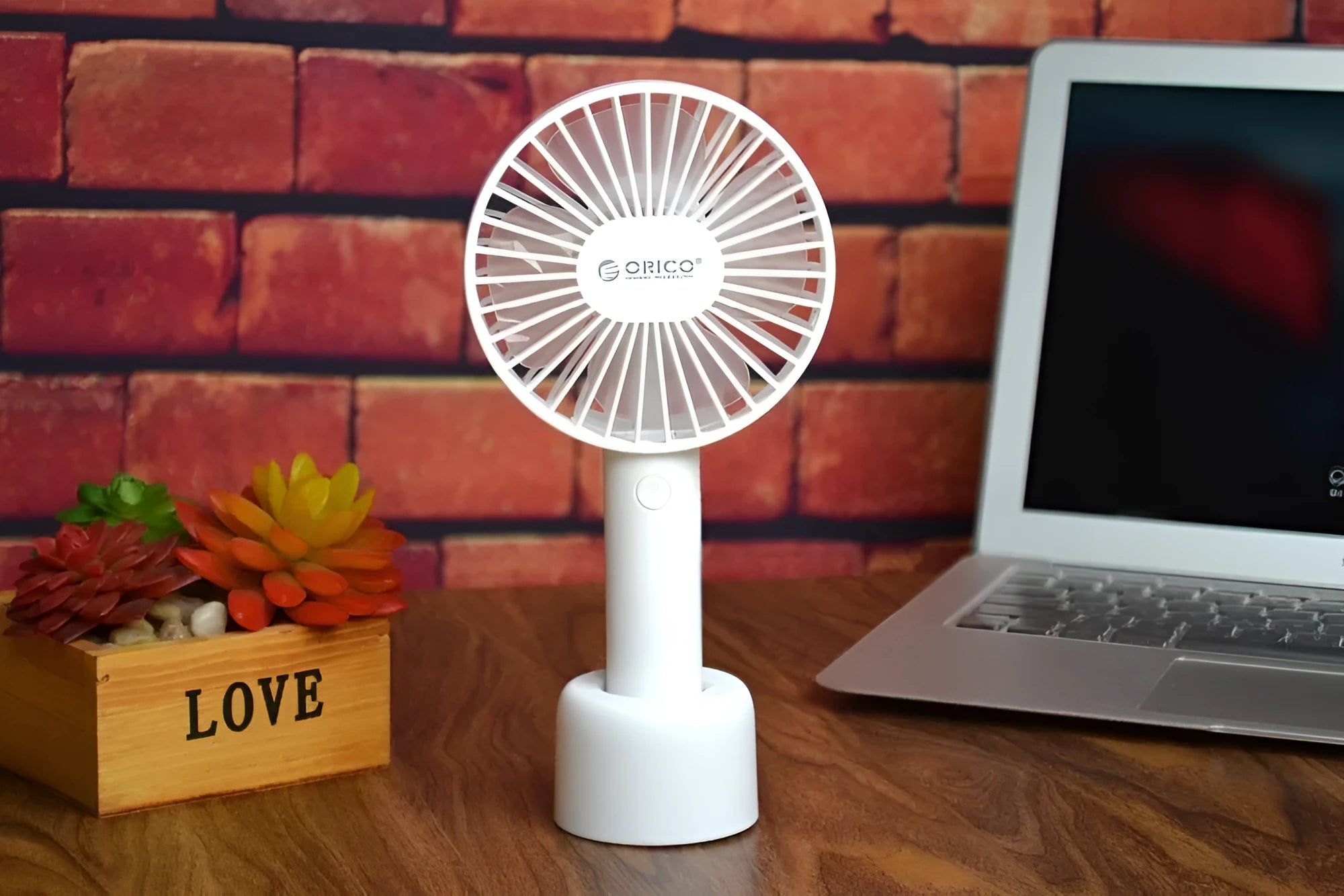 White ORICO FH1 USB rechargeable portable desktop fan with three-speed settings.