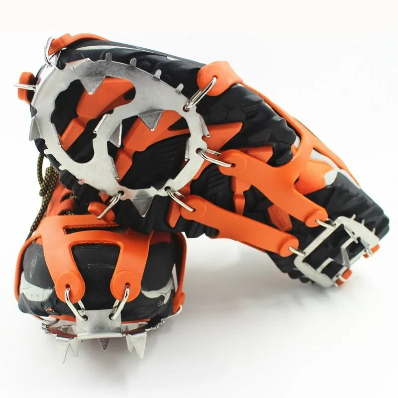 Reinforced non-slip crampons for shoes in black colour with large teeth, shown on a snowy surface
