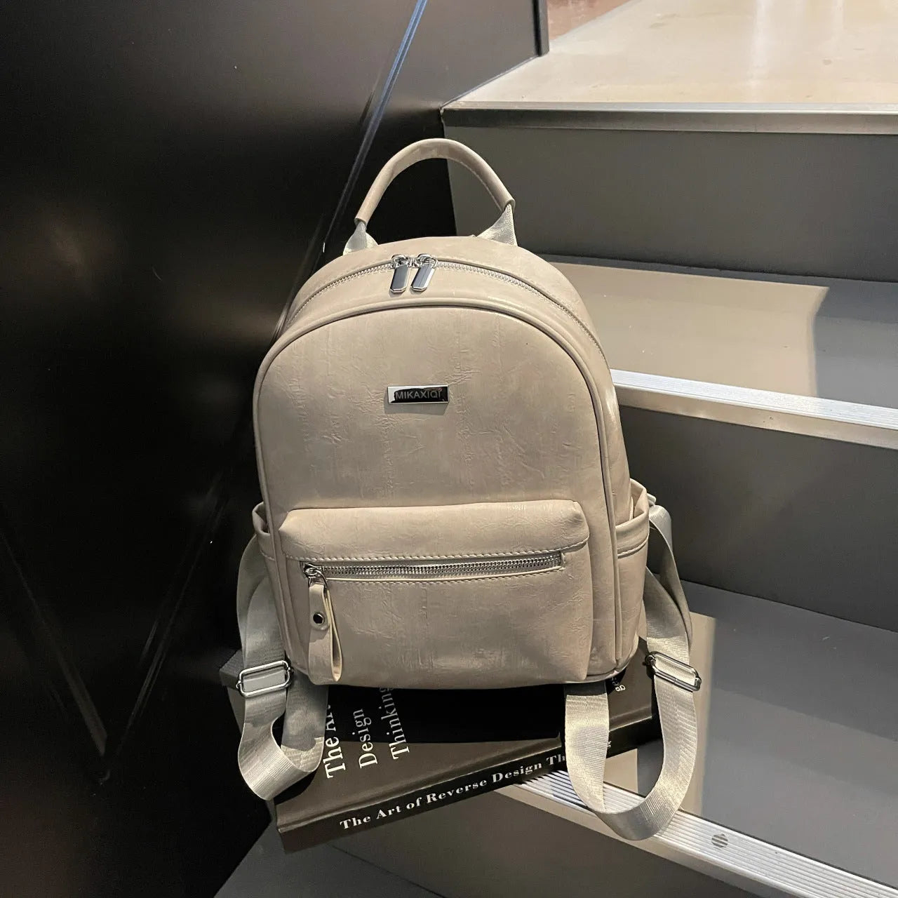 Simple fashion trendy ladies travel backpack in waterproof PU with sandwich pocket, available in multiple colours