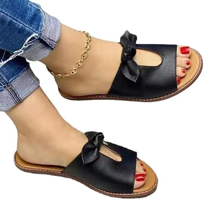 Ladies fish mouth sandals with a bow detail on the upper, shown in black, gold, and pink colour options.